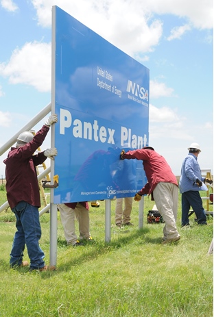 Workers put up a new entry sign at the Pantex Workers put up a new entry sign at the Pantex