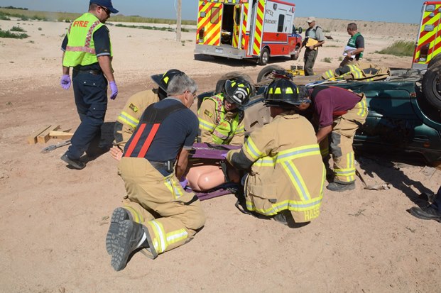 Pantex Fire Department emergency response personnel work to extract a training mannequin Pantex Fire Department emergency response personnel work to extract a training mannequin