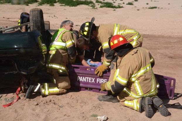 Pantex Fire Department emergency response personnel work to extract a training mannequin Pantex Fire Department emergency response personnel work to extract a training mannequin