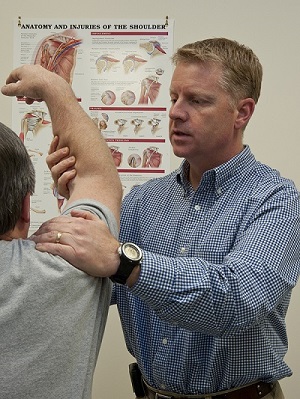Shoulders are common problem spots for physical therapy patients. Y-12 physical therapist Gary Hall examines the arm of a client. Shoulders are common problem spots for physical therapy patients. Y-12 physical therapist Gary Hall examines the arm of a client.