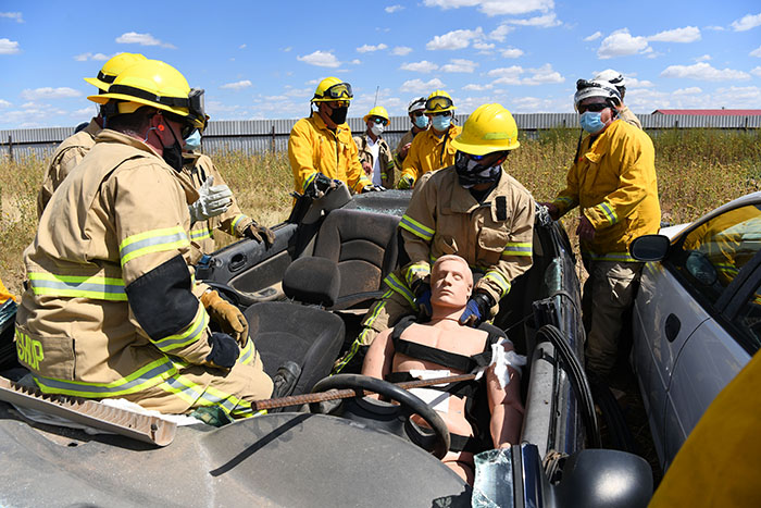 Firefighters practicing victim extraction