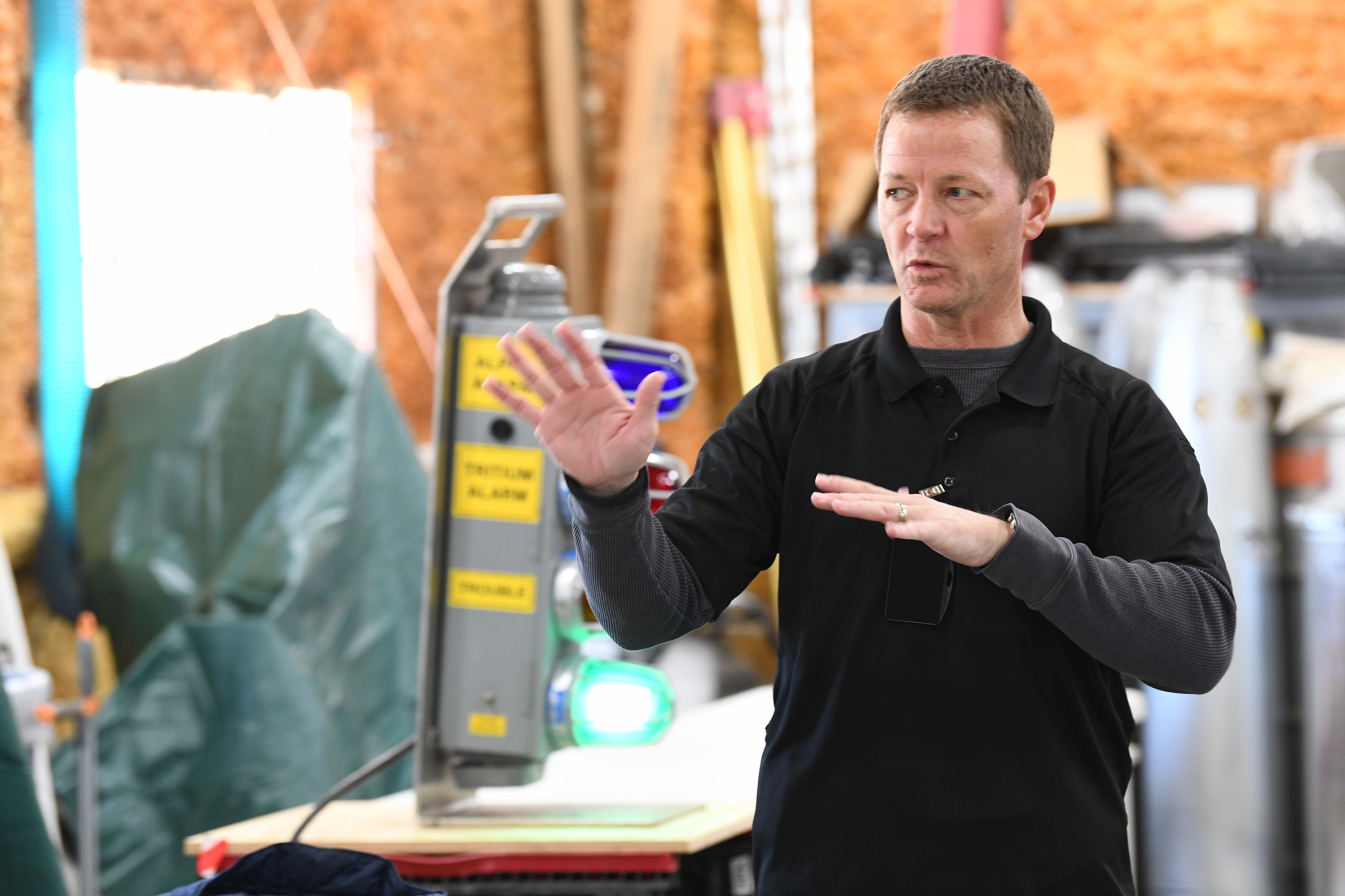 Instructor Brad Immel teaches a Conduct of Operations class 