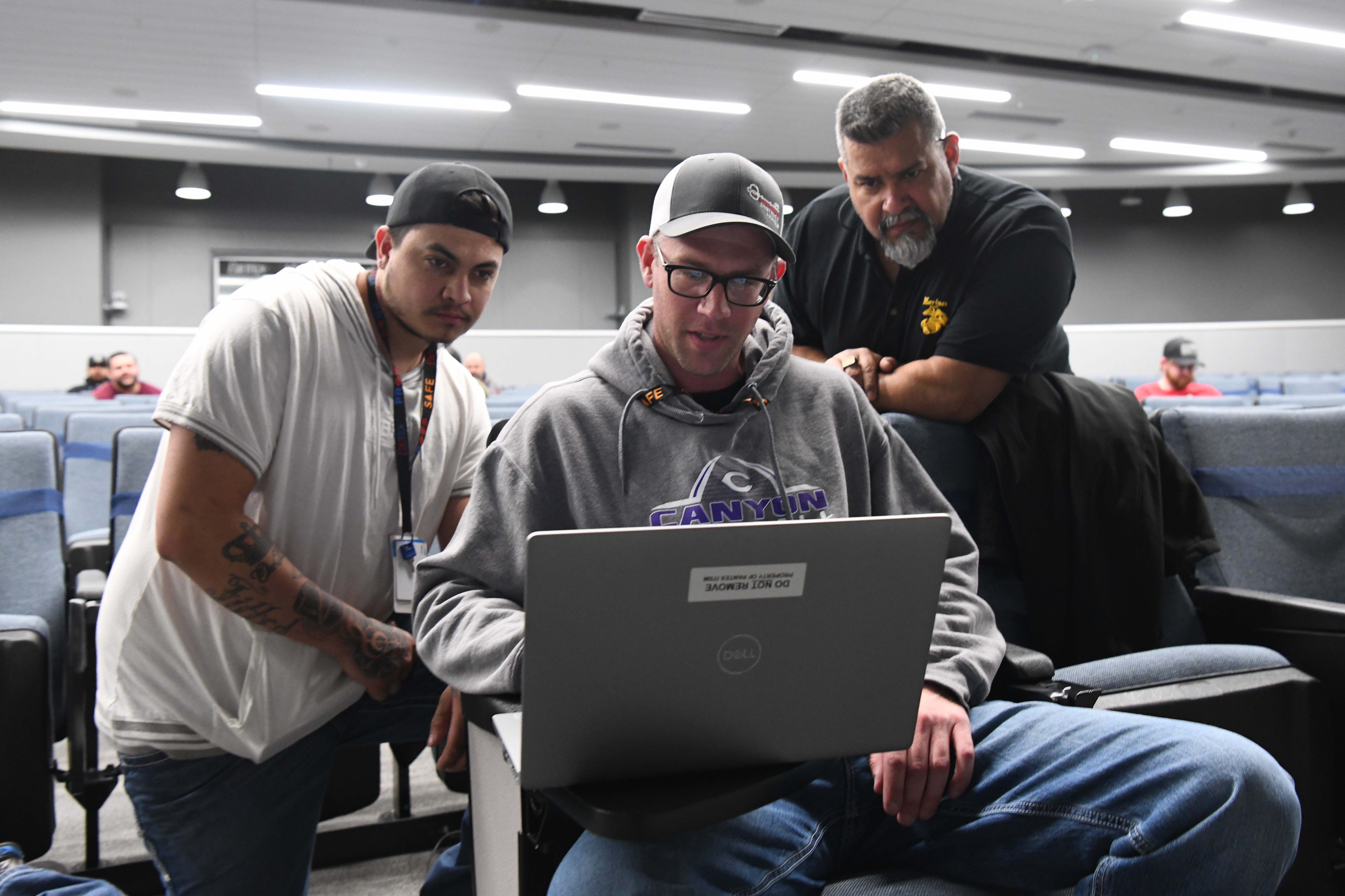 Production technicians work on training 