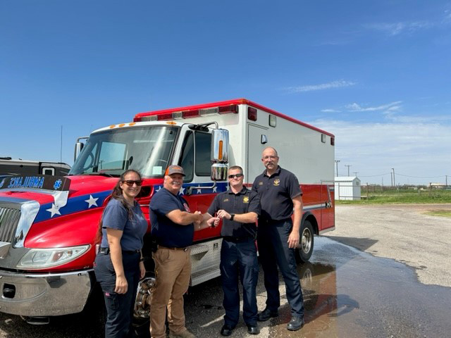 Members of the Pantex Fire Department hand over the keys to the loaned ambulance to the City of Perryton Members of the Pantex Fire Department hand over the keys to the loaned ambulance to the City of Perryton