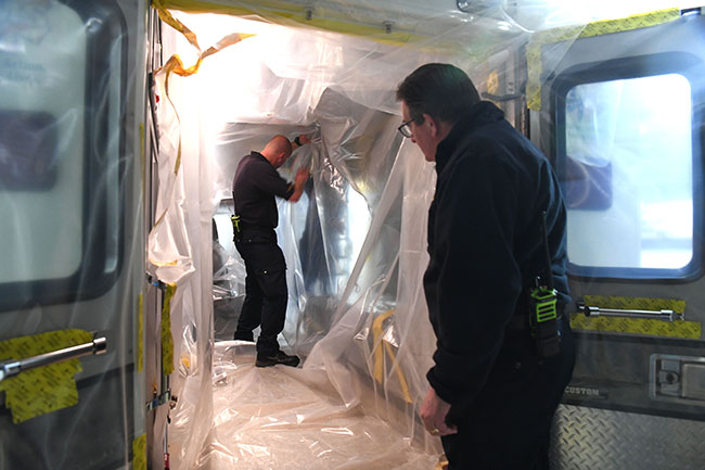 Members of the Pantex Fire Department install a Biocell Ambulance Protective System Members of the Pantex Fire Department install a Biocell Ambulance Protective System