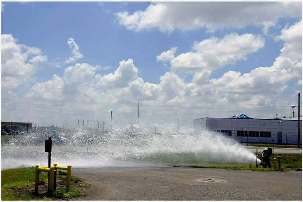 Pantex firefighters flush water from a fire hydrant Pantex firefighters flush water from a fire hydrant