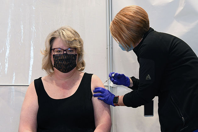 Michelle Reichert, CNS president and chief executive officer, receives her COVID‑19 vaccination from a Pantex medical provider. Michelle Reichert, CNS president and chief executive officer, receives her COVID‑19 vaccination from a Pantex medical provider.