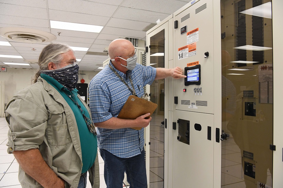 IT Systems administrators John Neusch (right) and Les Spaulding troubleshoot a new power distribution system in Pantex’s current data center IT Systems administrators John Neusch (right) and Les Spaulding troubleshoot a new power distribution system in Pantex’s current data center