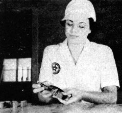 Ernestine O’Brien uses a micrometer to ensure exactness in production Ernestine O’Brien uses a micrometer to ensure exactness in production
