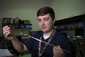 Y 12 intern Joshua W. holds the sensors used in the ChIMES (Chemical Identification by Magnetoelastic Sensing) Sensor Miniaturization project. Y 12 intern Joshua W. holds the sensors used in the ChIMES (Chemical Identification by Magnetoelastic Sensing) Sensor Miniaturization project.